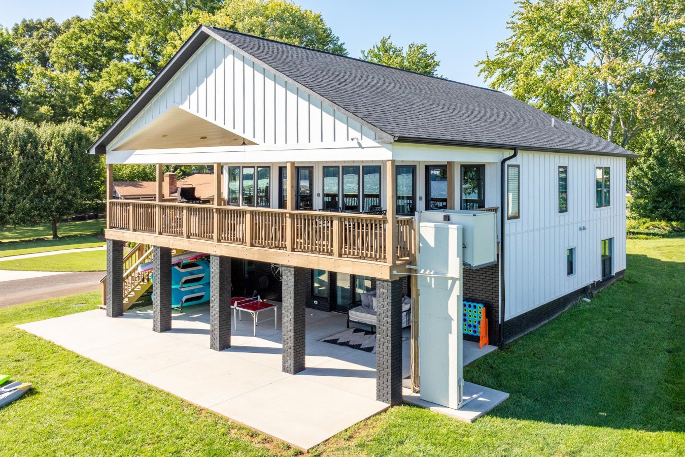 Back exterior of The Liquid Bullpen with covered deck and elevator